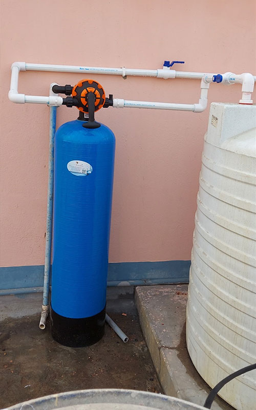 Media iron removal filter on terrace, entry-tank installation